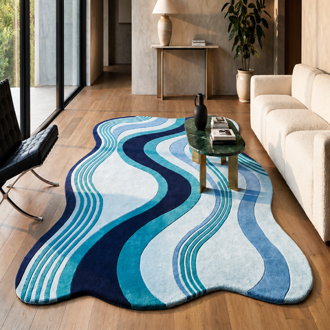 Ocean irregular hand-tufted rug in blue, brown, cobalt, and peach for eclectic living room