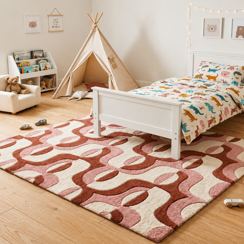Sienna Swirl abstract hand-tufted rug in cream, peach, and white with warm swirling patterns