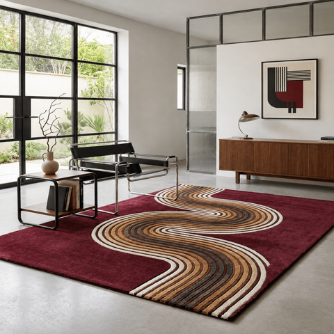 Serpents Path modern hand-tufted rug in brown, charcoal, and red with sinuous snake-like patterns