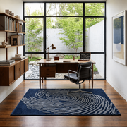 Whorl Indigo Rug - hand-tufted abstract wool rug with blue, cobalt and navy whorl pattern