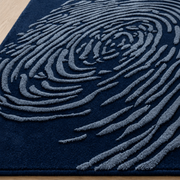 Whorl Indigo Rug - hand-tufted abstract wool rug with blue, cobalt and navy whorl pattern