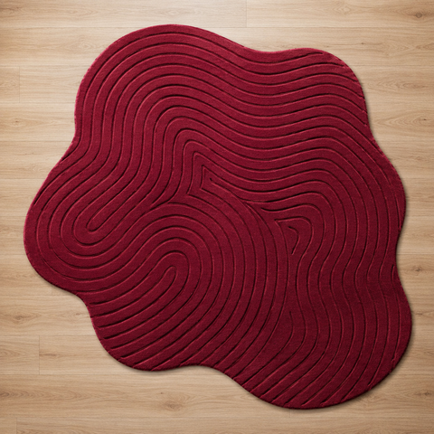 Ruby Wave irregular hand-tufted rug with bold ruby red wave-like patterns for dramatic living room