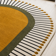 Solstic Oval modern hand-tufted rug in orange, white, and yellow with sunny solstice-inspired design
